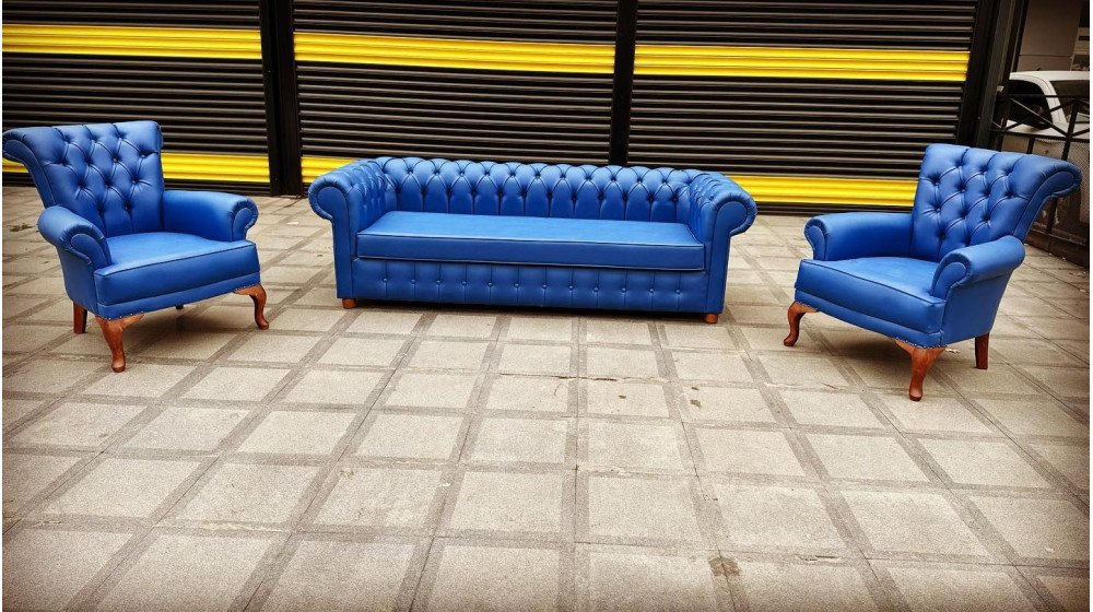 Tilia P Chester ofis oturma grubu, siyah deri, kapitone sırt ve heybetli kanat kolçaklar.